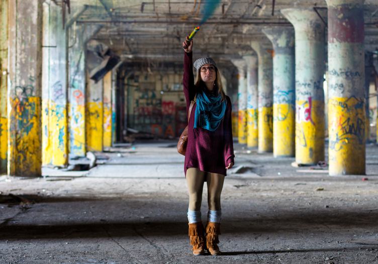 Woman Standing in an Abandoned Factory