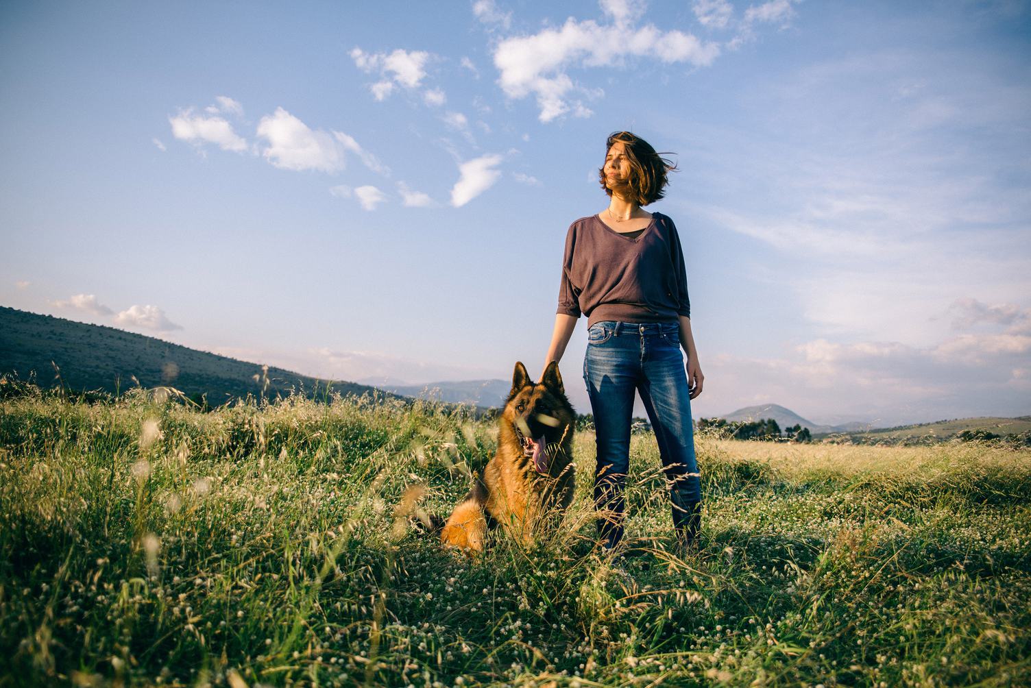 Woman Walking with her Dog German Shepherd