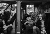 Black & White Photo of Three Guys Sitting and Waiting in the Car