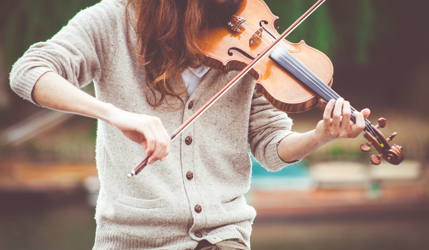 Woman Wearing Beige Sweater Playing Violin