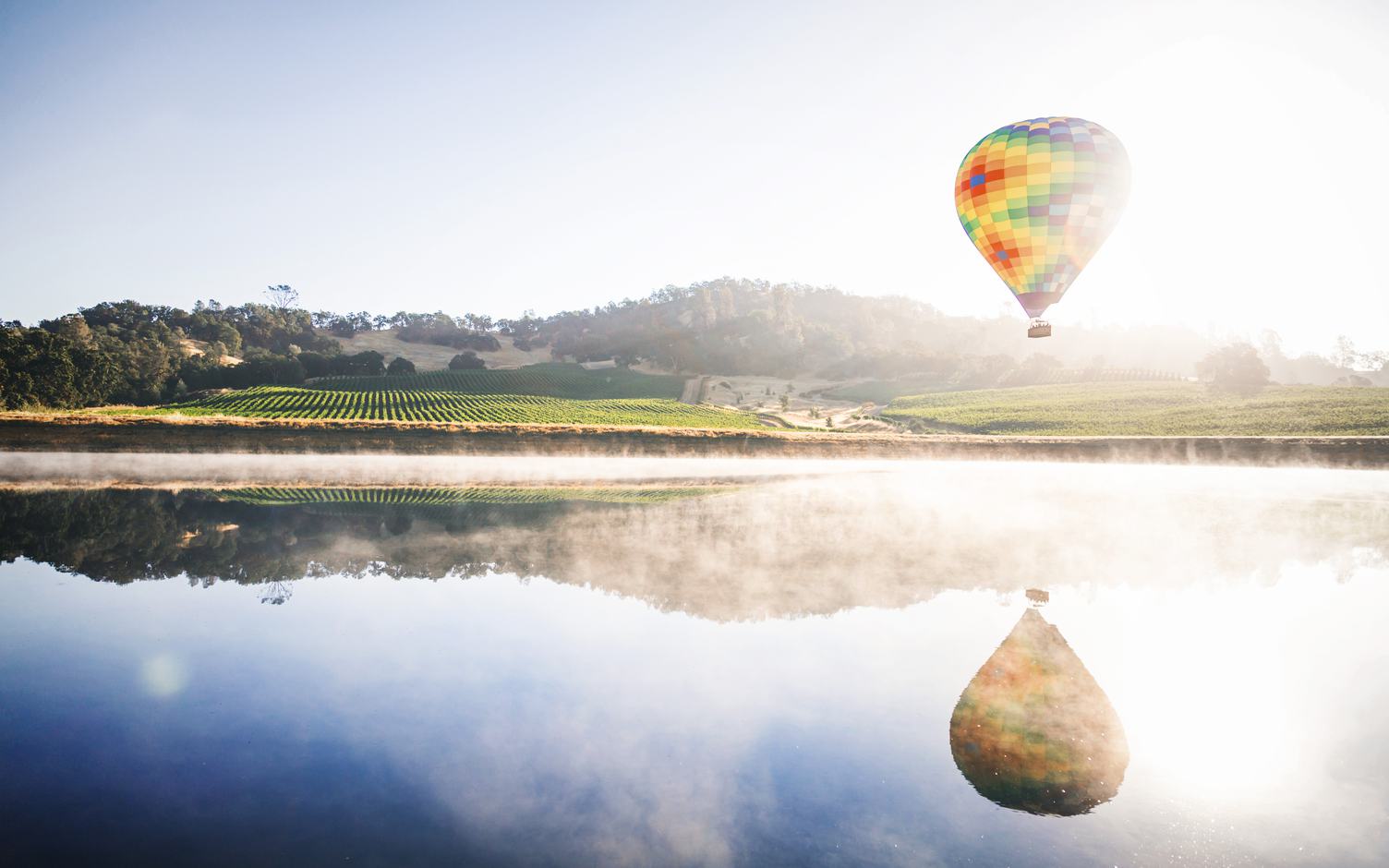 Colourful Hot Air Balloon Reflecting in a Lake