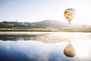 Colourful Hot Air Balloon Reflecting in a Lake