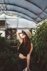 Yong Girl in the Greenhouse