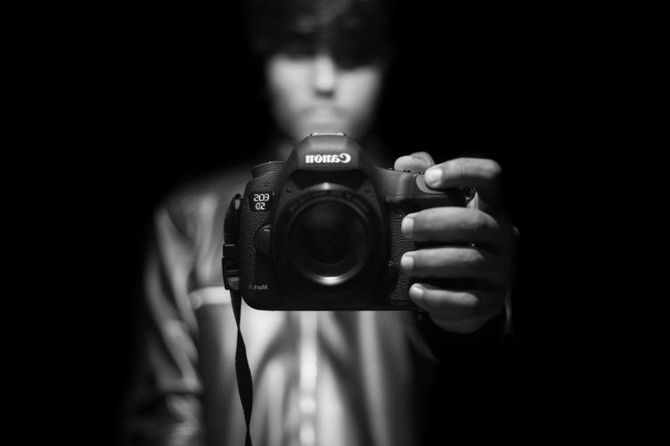 A Mirror Selfportrait of a Man Holding a Camera