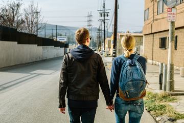 Couple Walking Holding Hands in an Urban Area