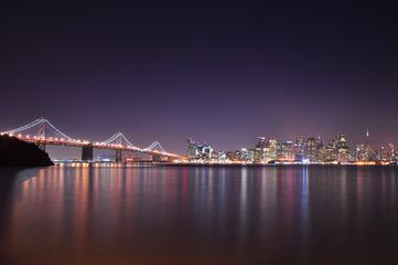 A Night View with City Lights Reflecting in a Bay