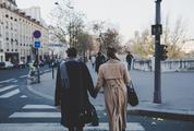 Young Couple Holding Hands Walking the Streets
