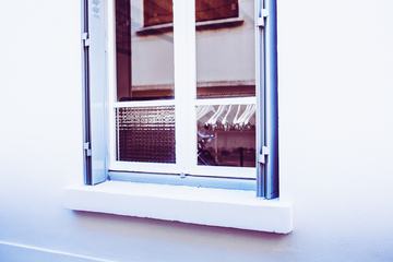 Wall with a Reflecting Wardrobe Window