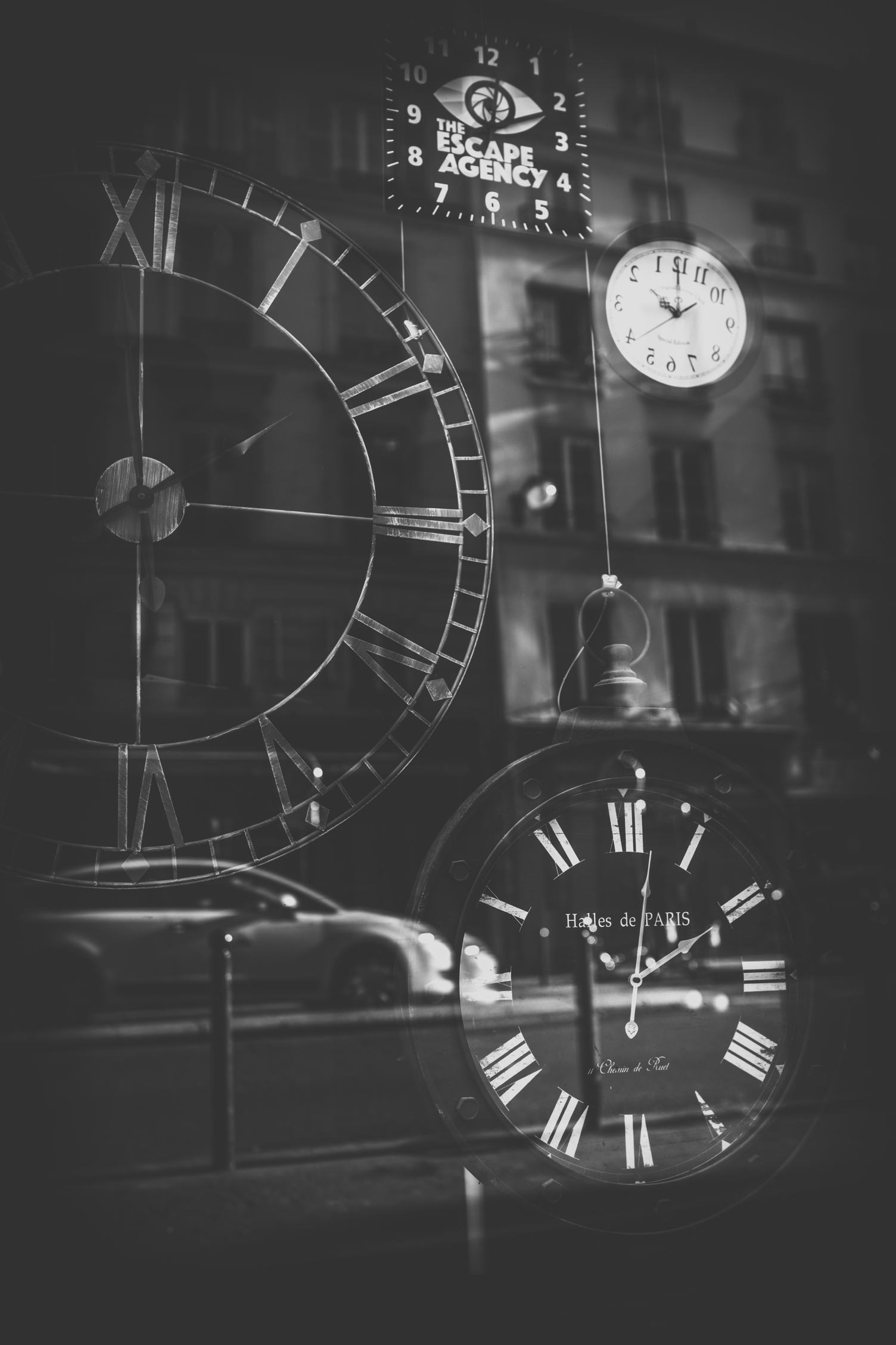 Clocks Shop Exposition Window Reflecting the Streets