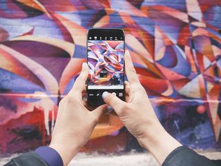 Hands Holding Smartphone Photographing Street Art