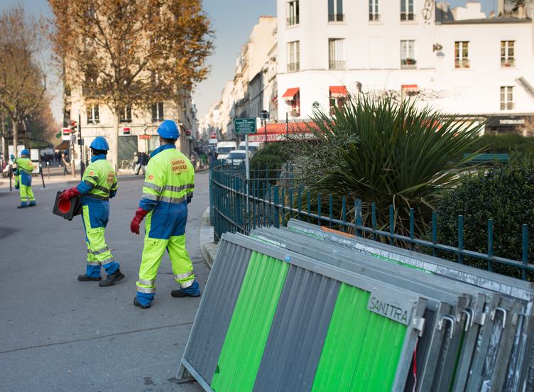 Municipal Workers Preparing Barriers and Bollards