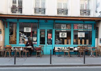 Sidewalk Terrace of a Blue Facade Cafe