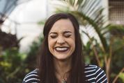 Brunette Laughing with Closed Eyes