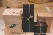 Multiple Gifts Wrapped in Paper with Twine Ribbons