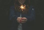 Woman with Red Nails Playing with Sparklers