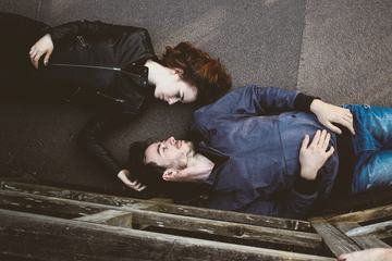 Man and Woman Together Lying on a Floor