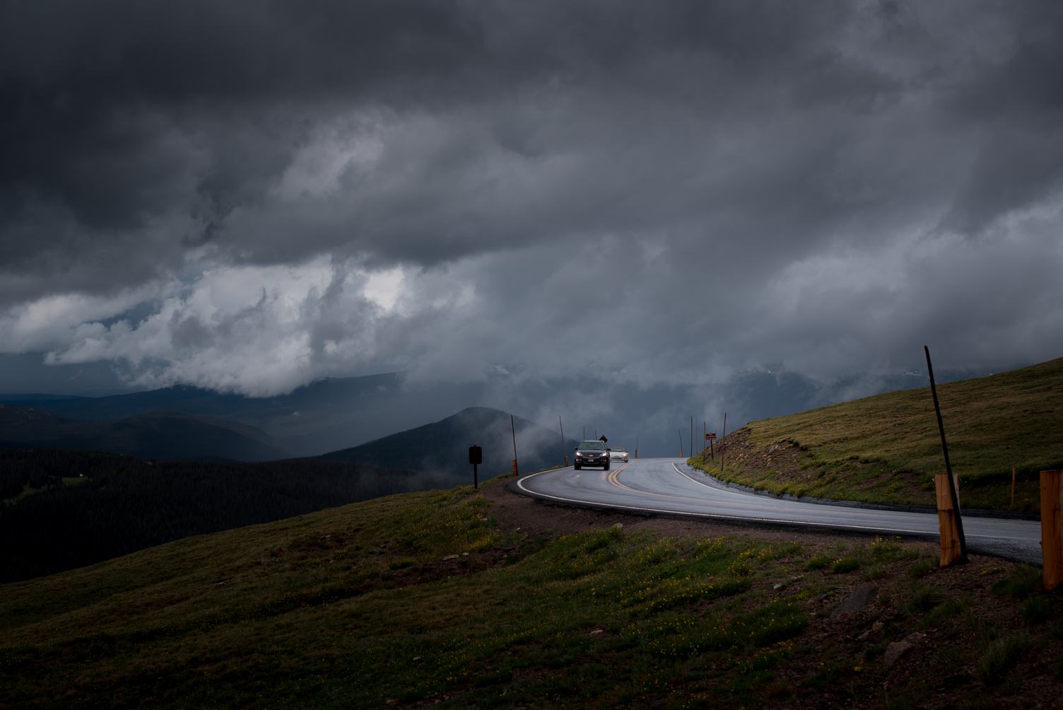 Curved Asphalt Road in a Mountainous Landscape before Storm