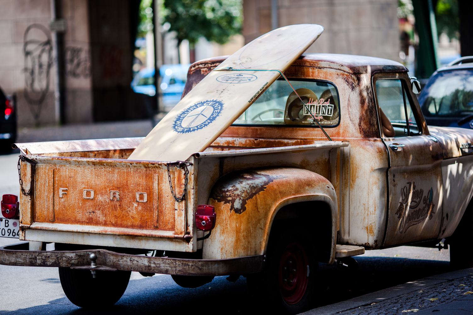 Rusty Pickup with a Surf Board