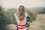 Blonde with Naked Back Wrapped in American Flag