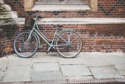 Vintage Bike with a Basket Against a Red Bricks Wall