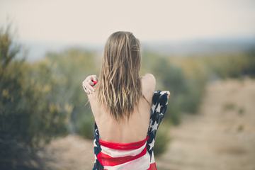 Blonde with Naked Back Wrapped in American Flag