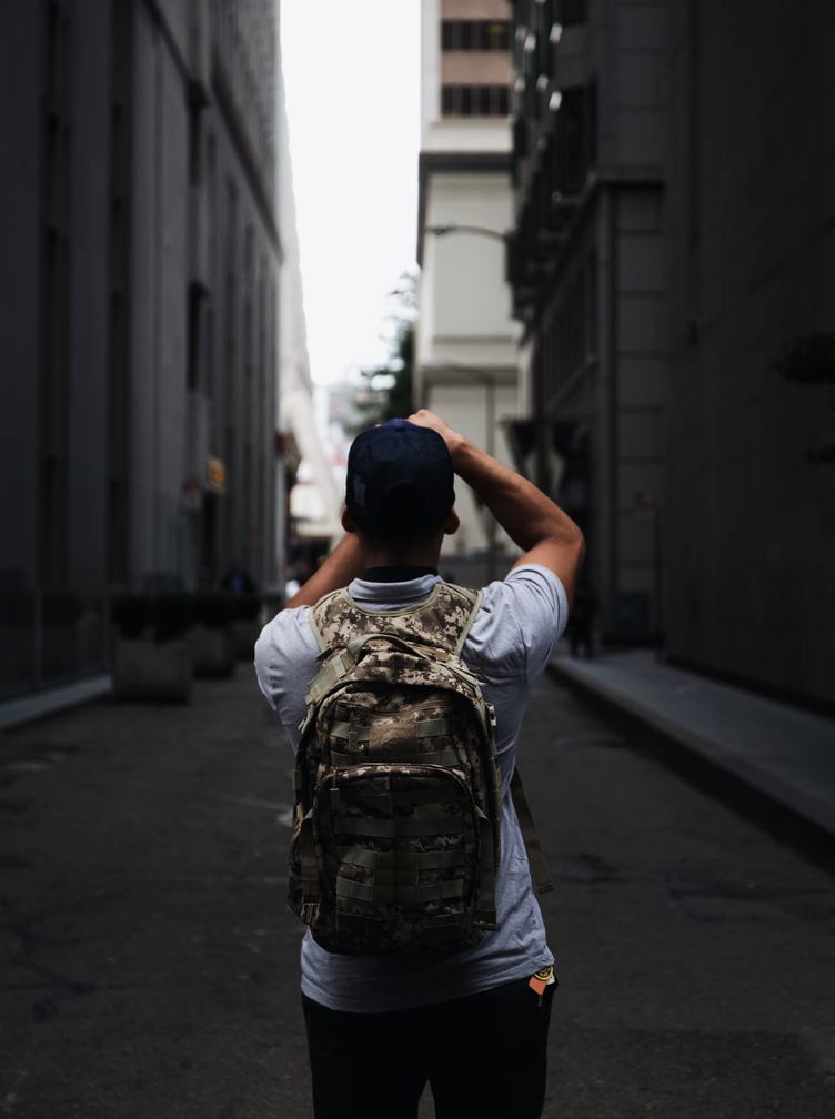 Man with a Backpack Taking Pictures