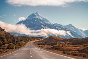 Road Leading Towards a Snow Capped Mountain in New Zealand