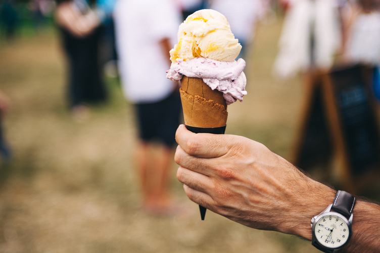 Ice Cream in the Cone on a Man Hand