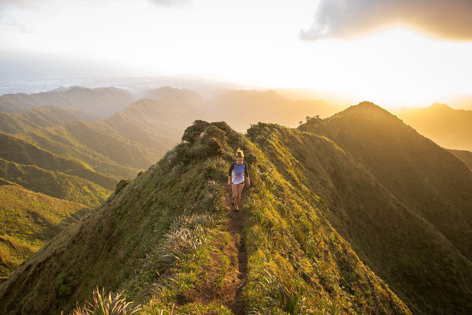 Woman Running in Mountains at Sunset