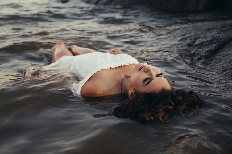 Young Woman Floating in Lake