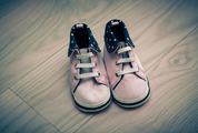 Pink Infant Shoes on Wooden Floor