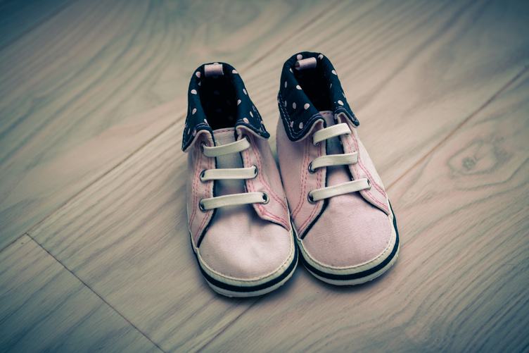 Pink Infant Shoes on Wooden Floor