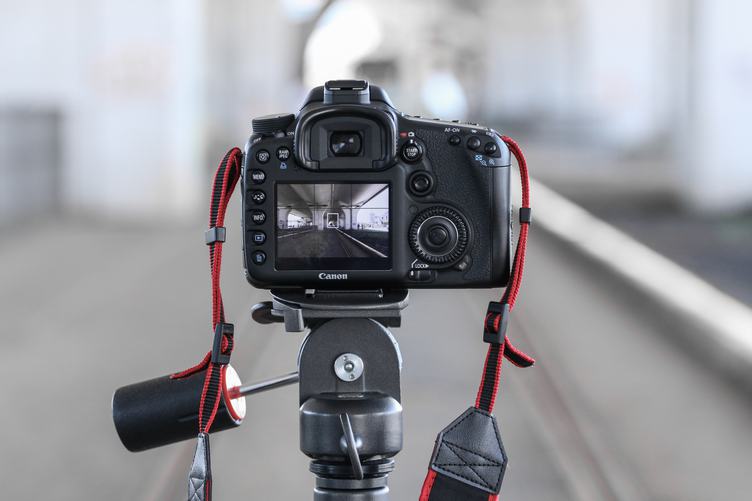 Rear DSLR Camera on Tripod with Blurred Background