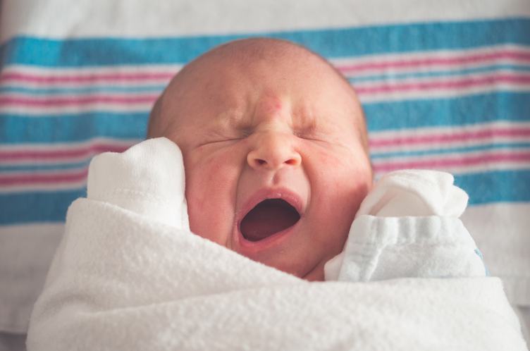 Newborn Baby Crying with Closed Eyes