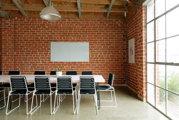 Conference Room in a Loft Style with Red Brick Walls