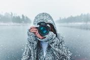 Woman Holding Nikon Camera Photographing Outdoors in Winter
