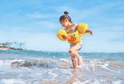 Happy Kid Girl Running the Summer Beach