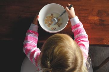 Little Girl Eating Cereals, Top View
