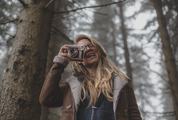 Woman in the Forest Hand Holding Retro Camera