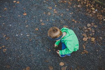 A Little Boy Playing Outside