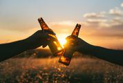 Cheers, Hands Toasting with Bottles of Beer