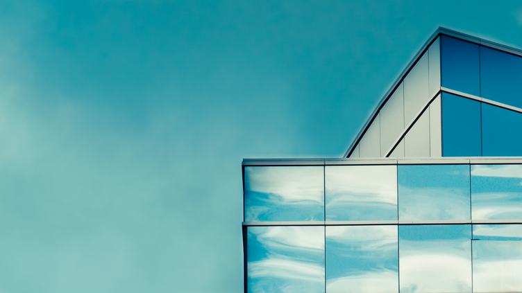 Sky is Reflected in the Glass of a Modern Building