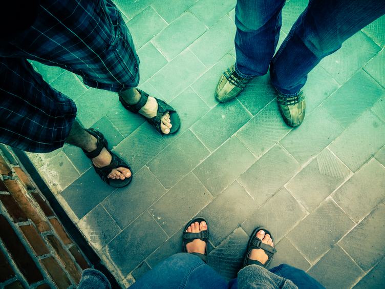 Foot and Legs of Three People Seen from above