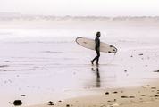 Surfer on the Ocean Beach