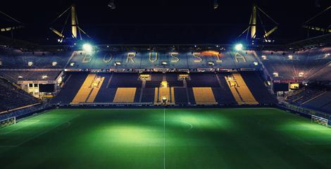 Empty Night Football Stadium in the Lights