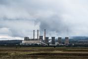 View of Coal Power Plant with Several Chimneys and Huge Fumes