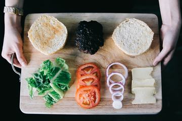 Delicious Fresh Homemade Burger Ingredients on a Wooden Tray