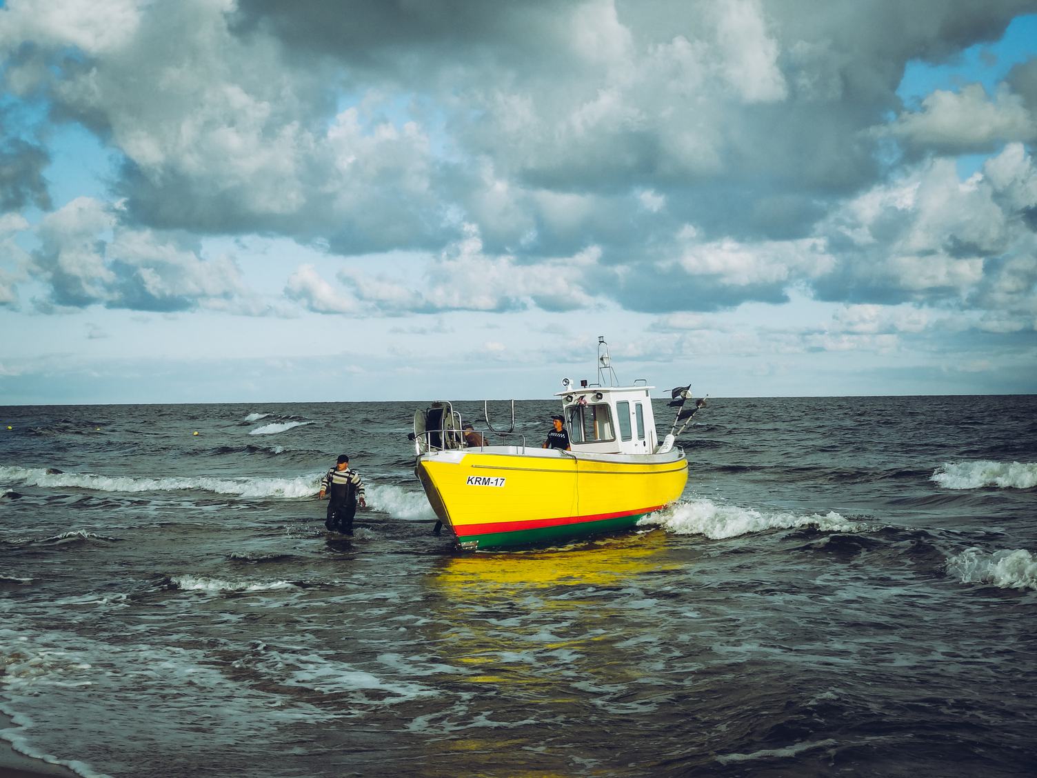 Yellow Fishing Boat Returns to the Shore