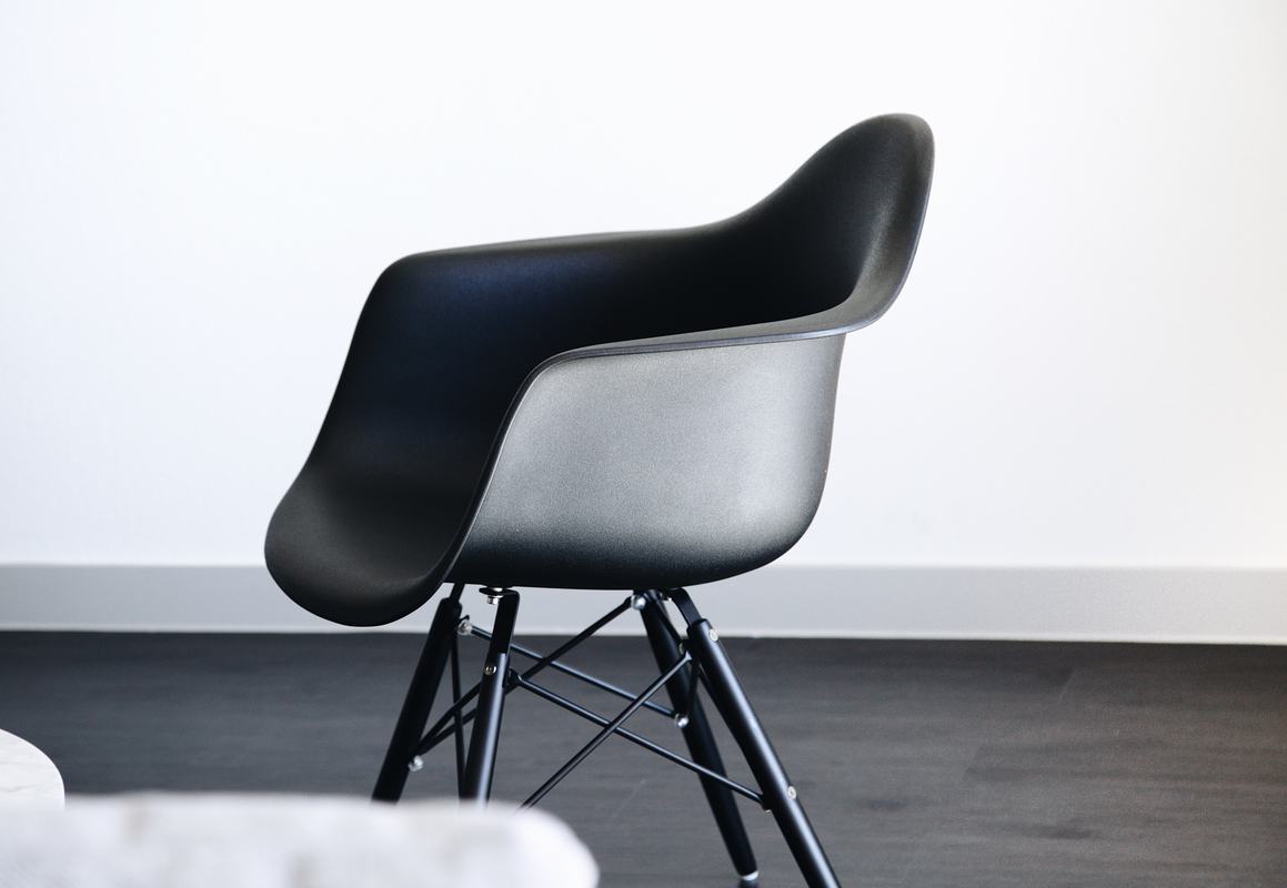 Free Photo Modern Black Chair in White Room Interior with a Dark Floor
