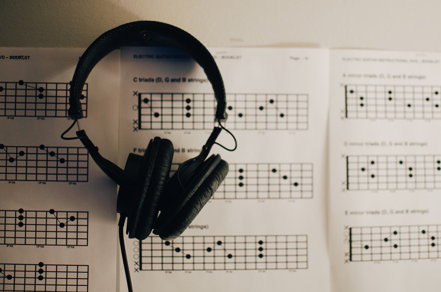 Music Sheets and Headphones on Table